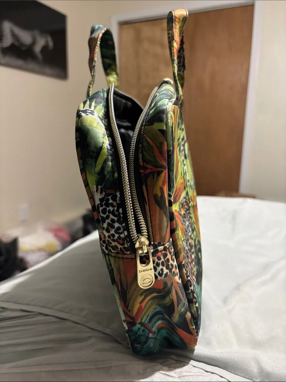 bebe Tropical Leaf & Animal Print lunch bag in Green, Black, Orange.